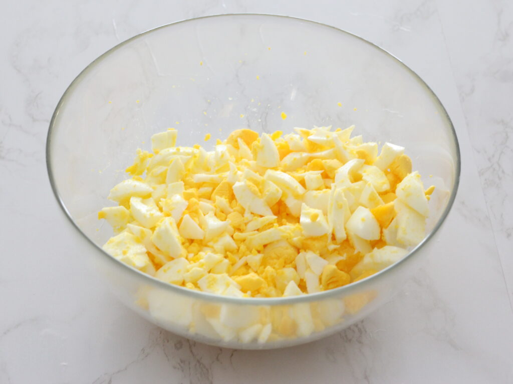 chopped up hard boiled eggs in a bowl