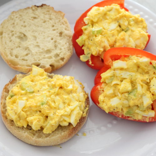 Egg salad on an English muffin and a red bell pepper