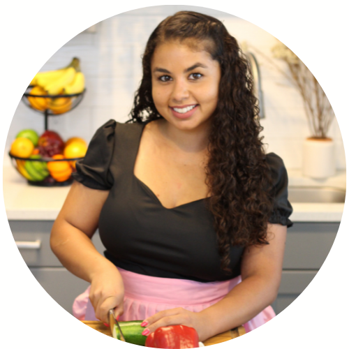 girl cuts vegetables on cutting board