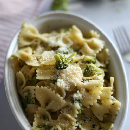 bow tie pasta and broccoli in an oval bowl