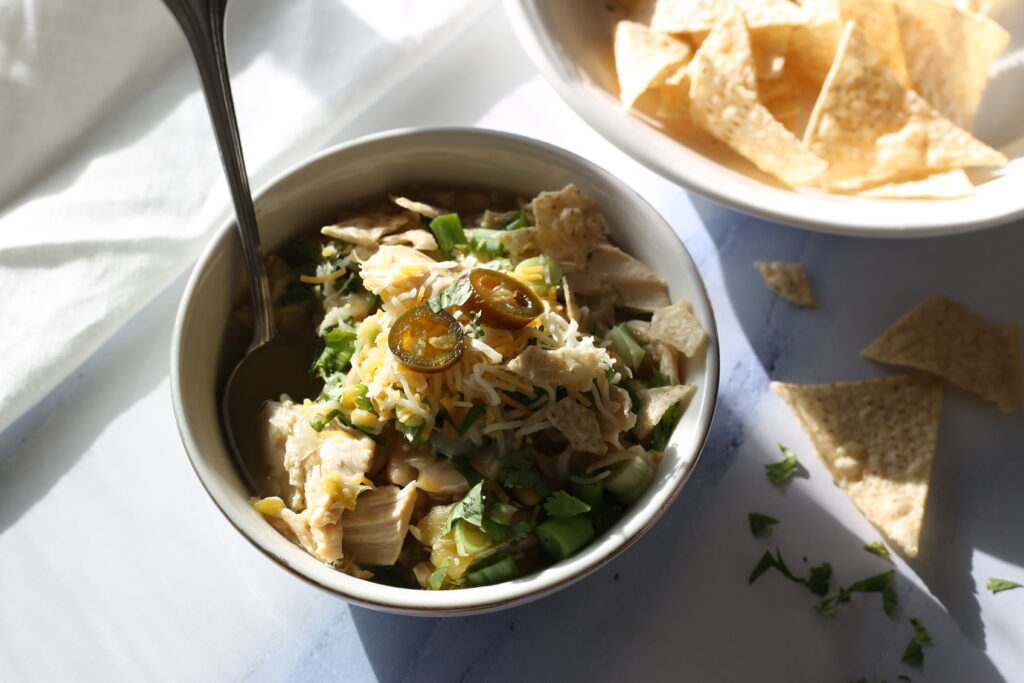 Chicken Chili in a bowl with tortilla chips