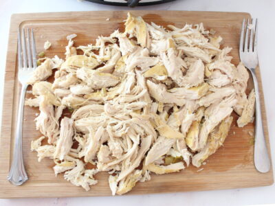 Shredded chicken with two forks