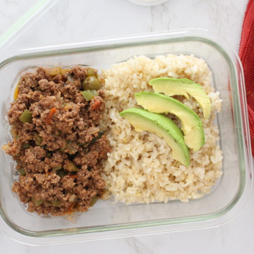 ground beef with brown rice and avocado in a glass container