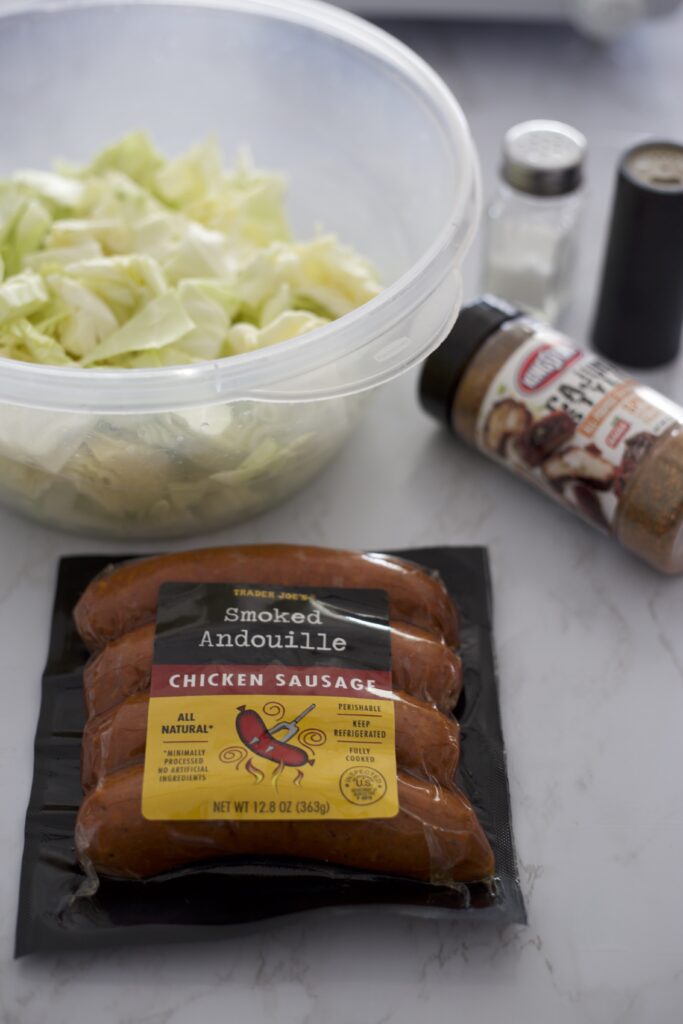 sausage and cabbage ingredients on a white table 