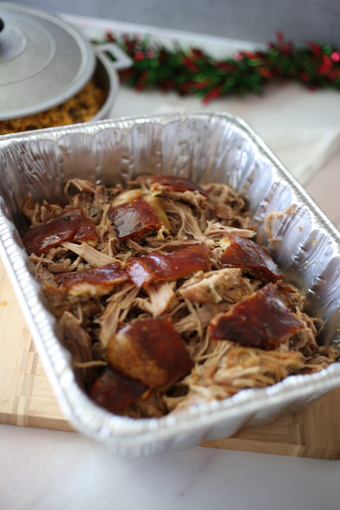 Carrved Pork Roast in an aluminum pan on a table. 