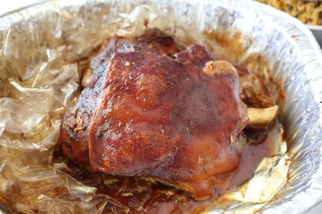 Crispy skin Pork Roast in an aluminum pan. 