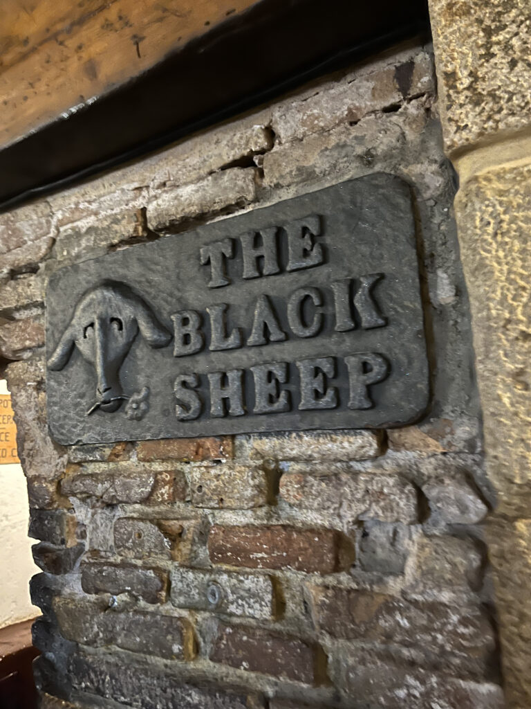 The Black sheep signage in black 