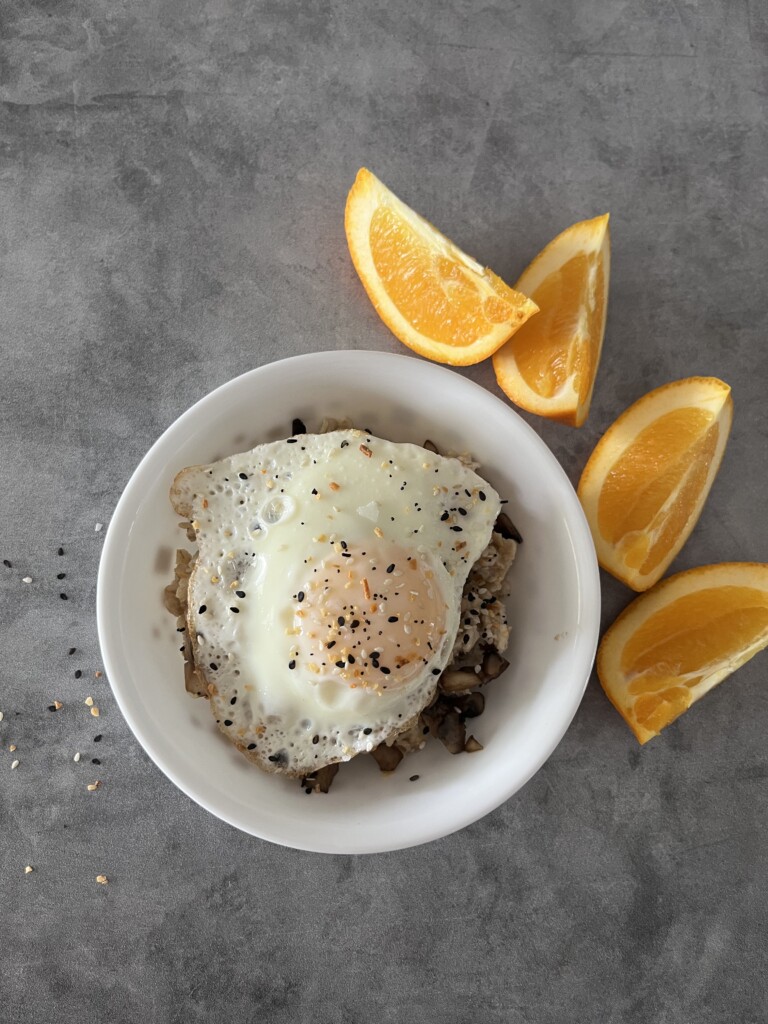 everything but the bagel oatmeal with an egg seasoned and sliced orange on the side